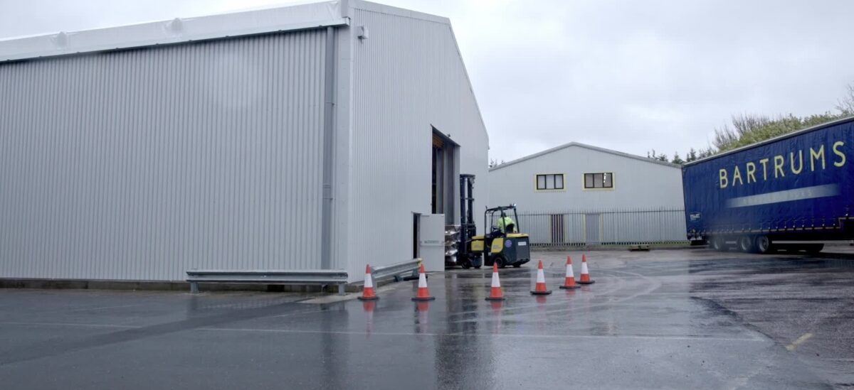 External view of temporary building installed to expand space at global chair components