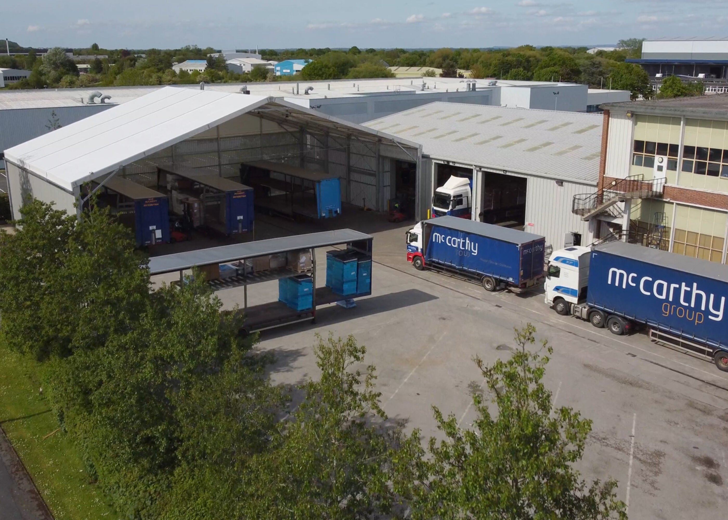 Drone picture of articulate lorries and semi permanent link shelter