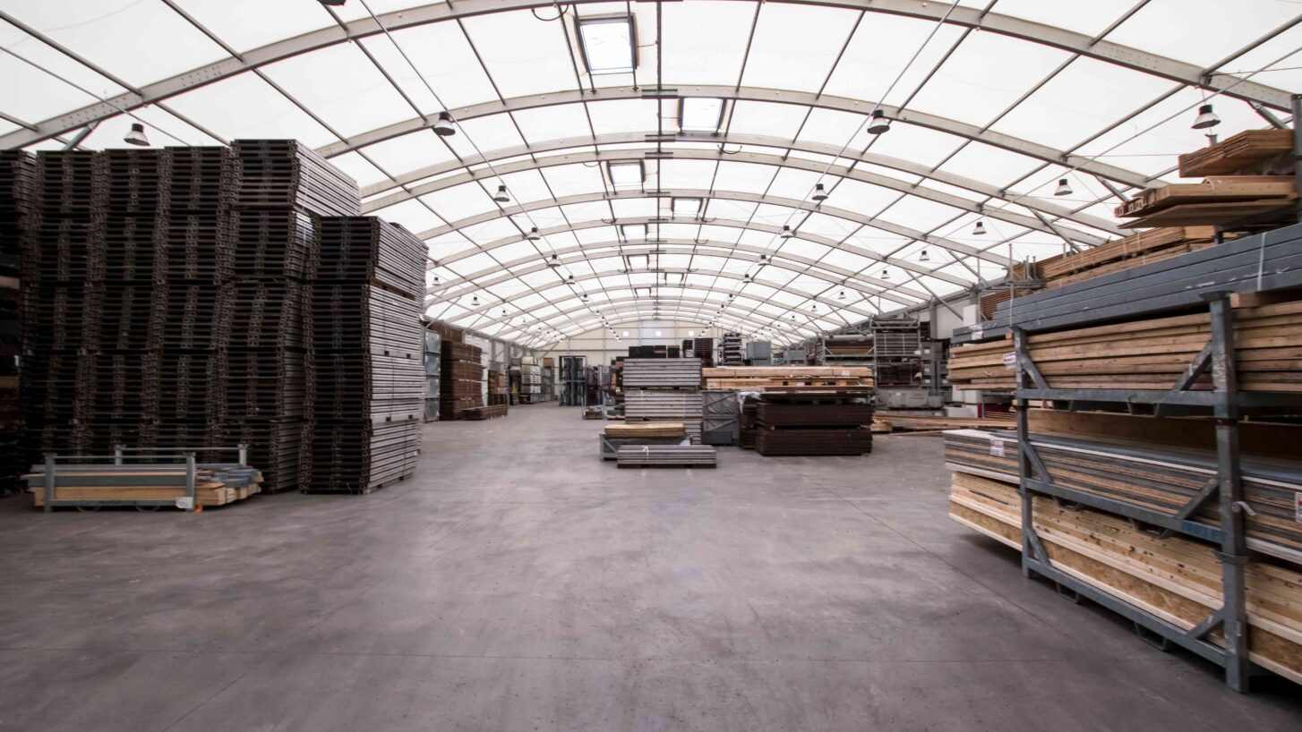 Inside a curved roof structure workshop warehouse
