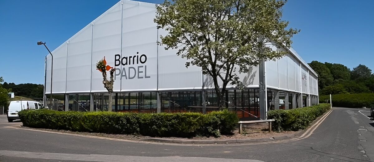 padel court facility from the side with an open lower area to keep it naturally open