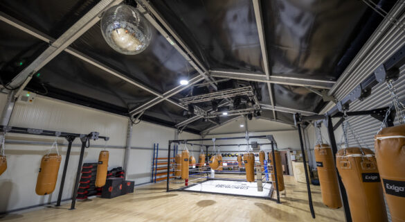 temporary gym structure with a boxing ring and facilities