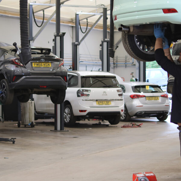 within a temporary workshop for cars to be serviced